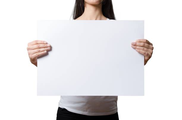 istock Close up view female hand hold on white paper board. 2051086702