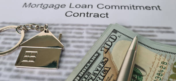 istock Mortgage agreement for a river and house 2051094198