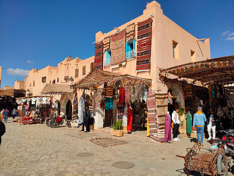 Safi, Morocco - April 08, 2023: View of traditional ceramic shops, with locals, in Safi, Morocco