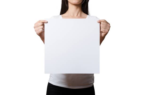 istock Close up view female hand hold on white paper board. 2051113882