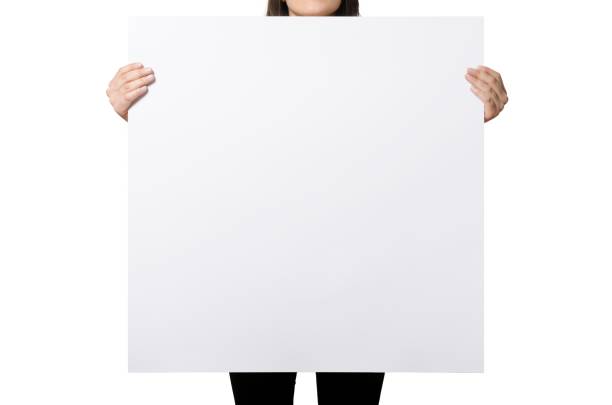 istock Close up view female hand hold on white paper board. 2051114953