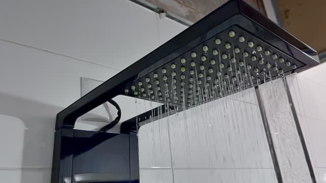 Beautiful and sophisticated shower opening and releasing water, in slow motion