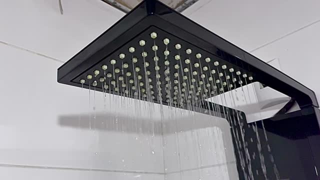 Beautiful and sophisticated shower opening and releasing water, in slow motion