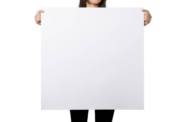 istock Close up view female hand hold on white paper board. 2051132990