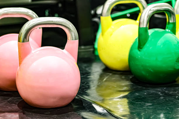 Kettlebells of different colors for cross training and bodybuilding