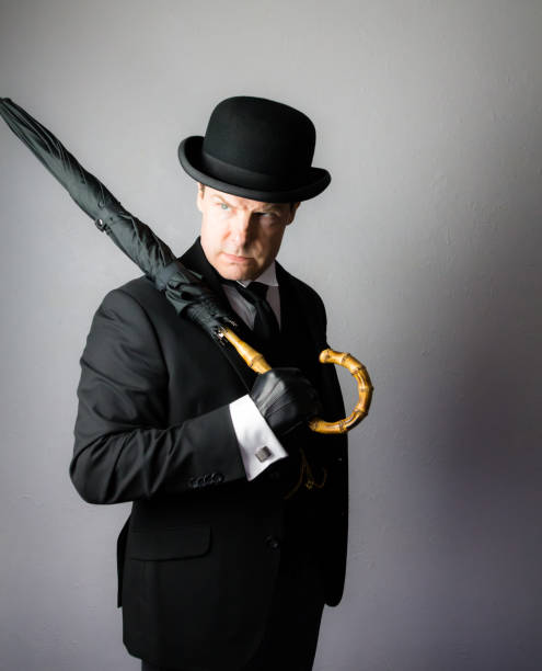 istock Vintage British Gentleman in Bowler Hat and Umbrella 2051165304