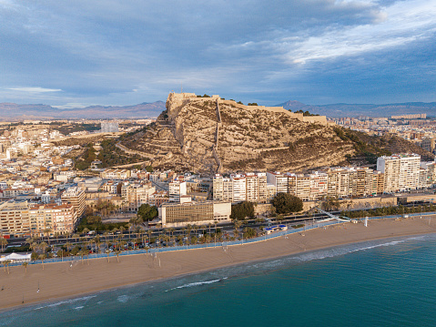 A Scenic beach with buildings and ocean view in distance: Alicante