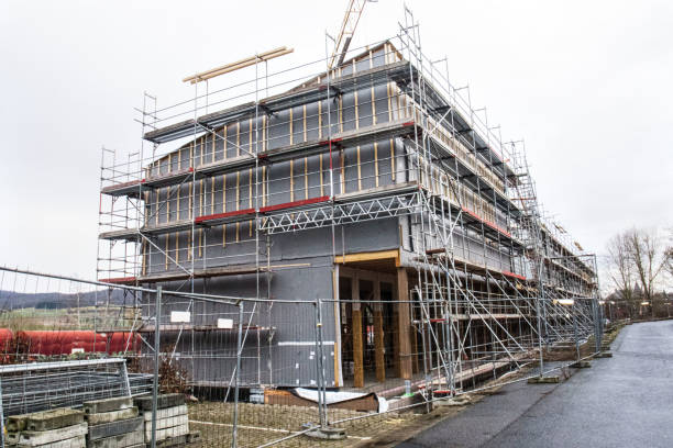 istock scaffolding at a construction site,  construction site of modern apartment building 2051256446