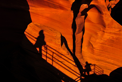 Shadow of hikers on the exit stairs of the Lower Antelope Slot Canyon, Page, Arizona, Southwest USA.