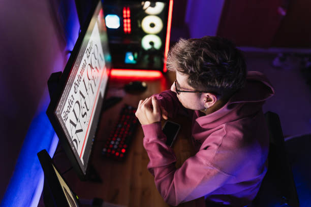 istock Graphic designer in casual clothes working with his new project in his room at night 2051292033