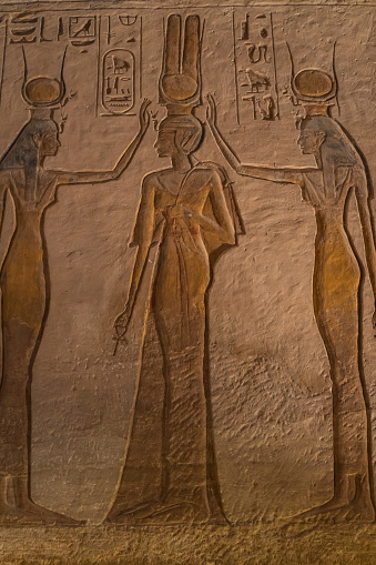 honoring the goddess Hathor, personified by Nefertari, Rameses's most beloved of his many wives, in stone carved wall mural in her temple at Abu Simbel