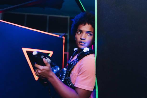Teenaager boy playing laser tag