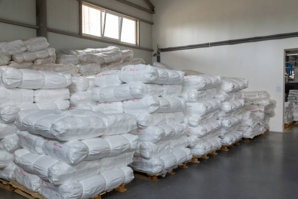 istock Factory warehouse with new white polypropylene bags ready to ship to customer. 2051317499