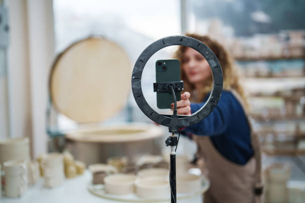 istock Woman shooting a marketing video about ceramic works. 2051318533