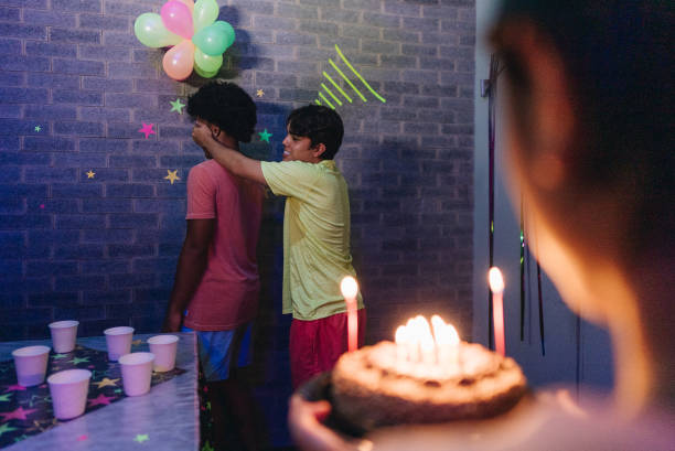 istock Friends doing a surprise birthday at home 2051325889