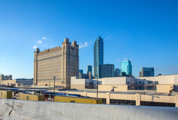 Fort Worth, Texas - November 4, 2023: Texas and Pacific Terminal and Warehouse, Fort Worth, Texas built bWyatt Cephus Hedrick with train station in foreground.