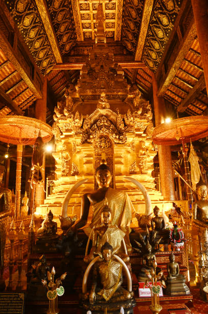 istock Luang Phor Phet, the principal Buddha image and beautiful Buddha statues that are hundreds of years old inside the chapel at Wat Phra That Chom Thong Worawihan. 2051372949