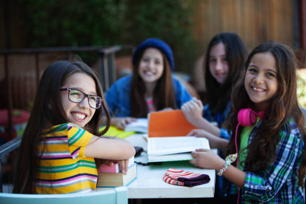 Girls studying and having fun, doing homework, back to school