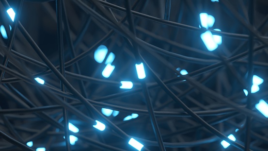 Tangled wires with glowing blue lights, creating a complex network.