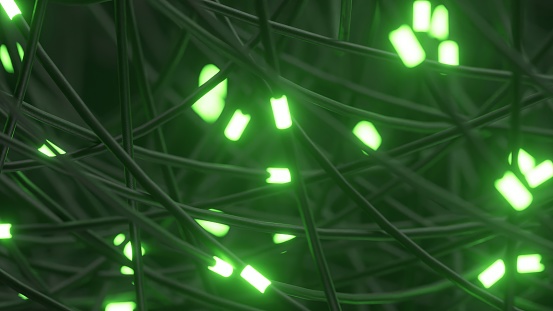 Network of tangled wires with glowing green nodes, suggesting a complex digital system.