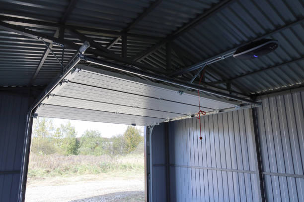 istock Open raised up automatic lift gate iron rural garage, hoist motor on top 2051489675
