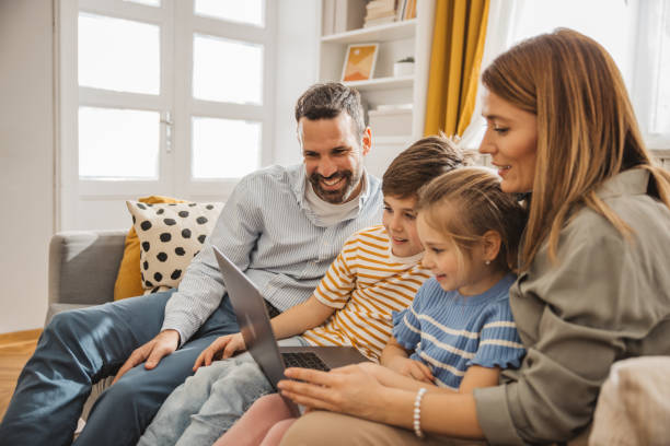 istock Joyful family using laptop 2051502216