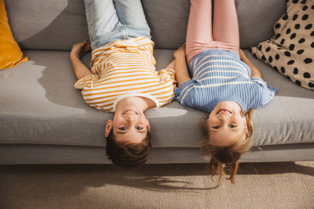 istock Happy children plying on couch 2051503797