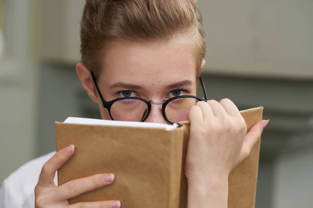 pretty woman with a book in his hands outdoors reading Lifestyle. High quality photo