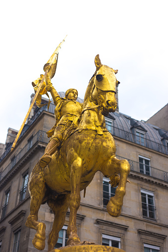 Paris, France: The gilded bronze Jeanne d’Arc equestrian statue in Place des Pyramides in the 1st arrondissement; the statue is by Emmanuel Frémiet was inaugurated in 1874.