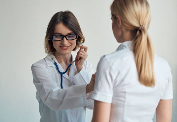istock The doctor listens to the patient's heartbeat through a stethoscope on a light background cropped view 2051544607