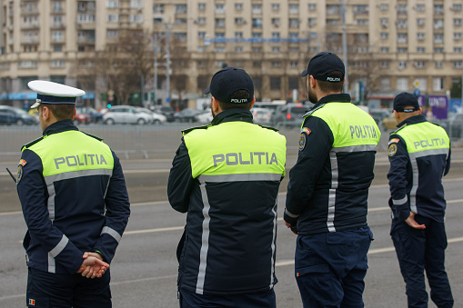 Bucharest, Romania - 1st Mar, 2024: Policemen from the Traffic Brigade prepares to offer flowers to women drivers on the occasion of Martisor, a Romanian tradition in early spring.