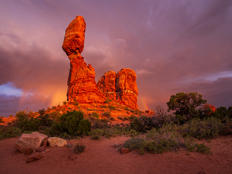 Balanced Rock is one of the most popular features of Arches National Park, situated in Grand County, Utah, United States. The total height of Balanced Rock is 128 feet (39 m), with the balancing rock rising 55 feet (16.75 m) above the base.