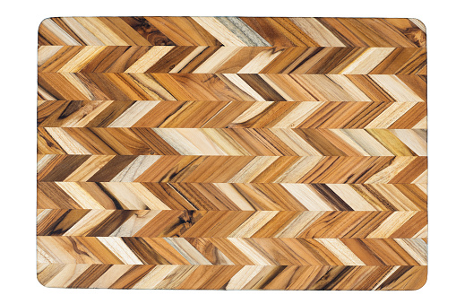 Top view of a textured, brown, chevron patterned cutting board with clipping path.
