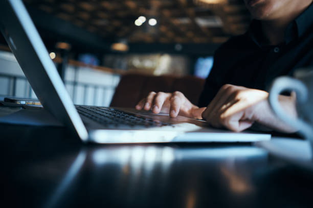 istock Business man freelancer working in a cafe laptops communication phone room manager model 2051615002