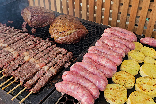 Meat and sausage skewers, sweet potato slices and two whole pieces of picanha. Very organized barbecue