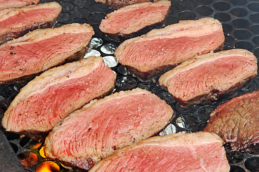 Series of steaks arranged side by side