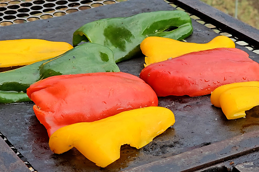Red, green and yellow peppers