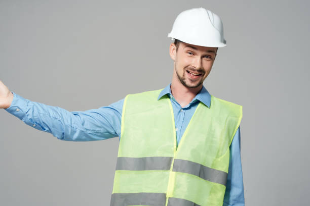 istock male builders protection Working profession light background 2051638228