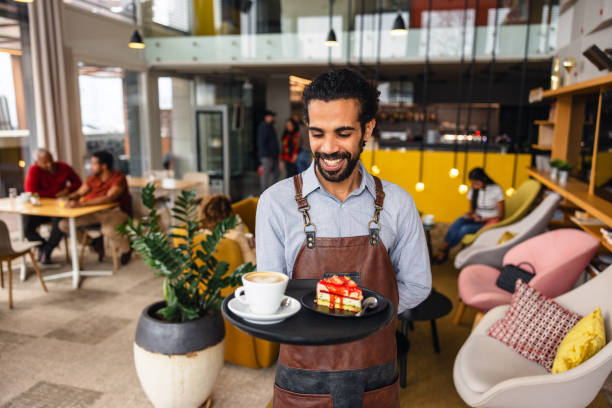 istock A Cheerful Adult Male Middle Eastern Bartender Working In A Charming Cafe 2051676952