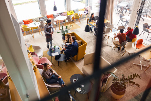 istock A Charming Coffee Shop Full Of Diverse Customers 2051679148