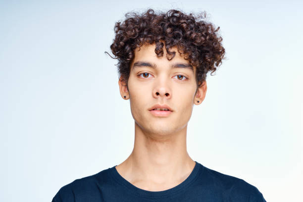 istock cute guy curly hair face close up skin care studio 2051713809