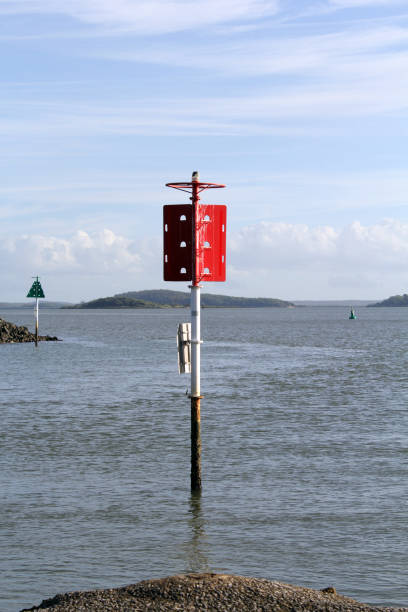 istock Red navigation marker in the ocean sea water 2051786633