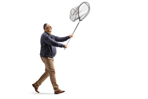 istock Mature man walking and holding a catching net 2051789860