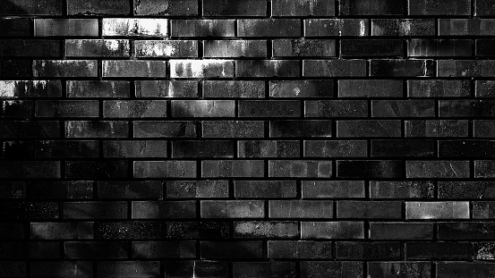 Grunge brick wall texture black background