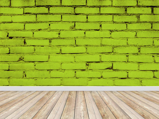 istock Brick wall interior green background with a wooden floor 2051798267