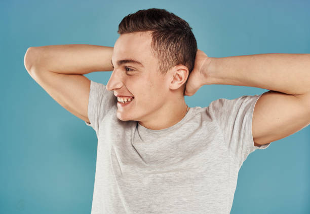 istock Cute man white t-shirt emotions cropped view blue background 2051827509