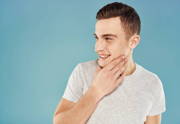 istock Cheerful man white t-shirt emotions cropped view blue background 2051828526