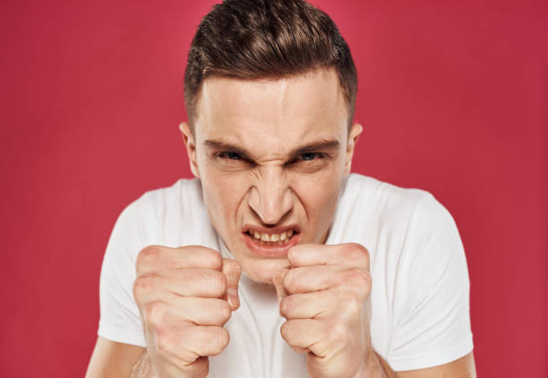 istock angry man in t-shirt discontent irritability close-up 2051837809