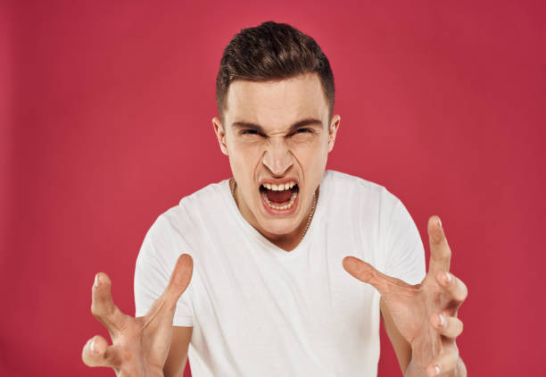 istock Man made t-shirts with 6 hands discontent red background emotions 2051838865