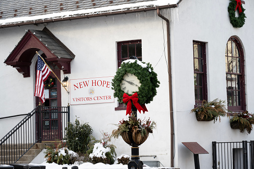 New Hope, USA - January 20, 2024. Clock decorated for Christmas in front of Visitors Center, New Hope, Pennsylvania, USA